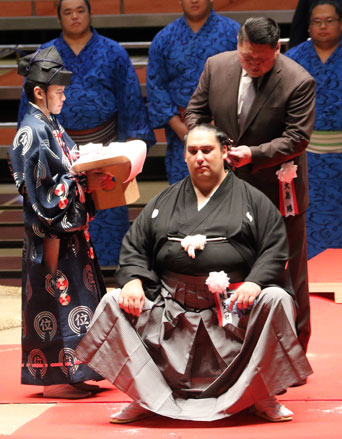 The Oshima elder takes a snip