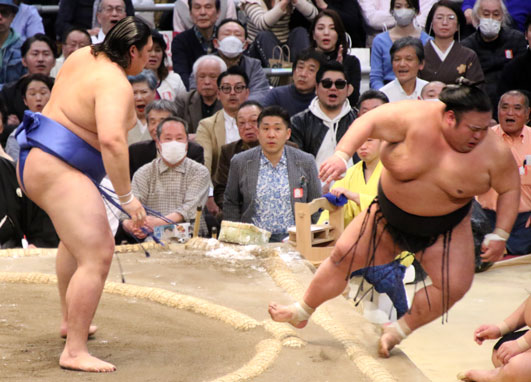 Onosato drives the ozeki Takakeisho off the dohyo at the March 2024 tournament