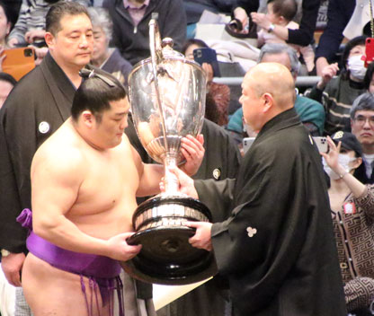 Takerufuji receives the Emperor's Cup after the March 2024 tournament